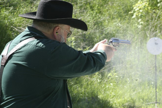 club member participating in cowboy action shooting demonstration
